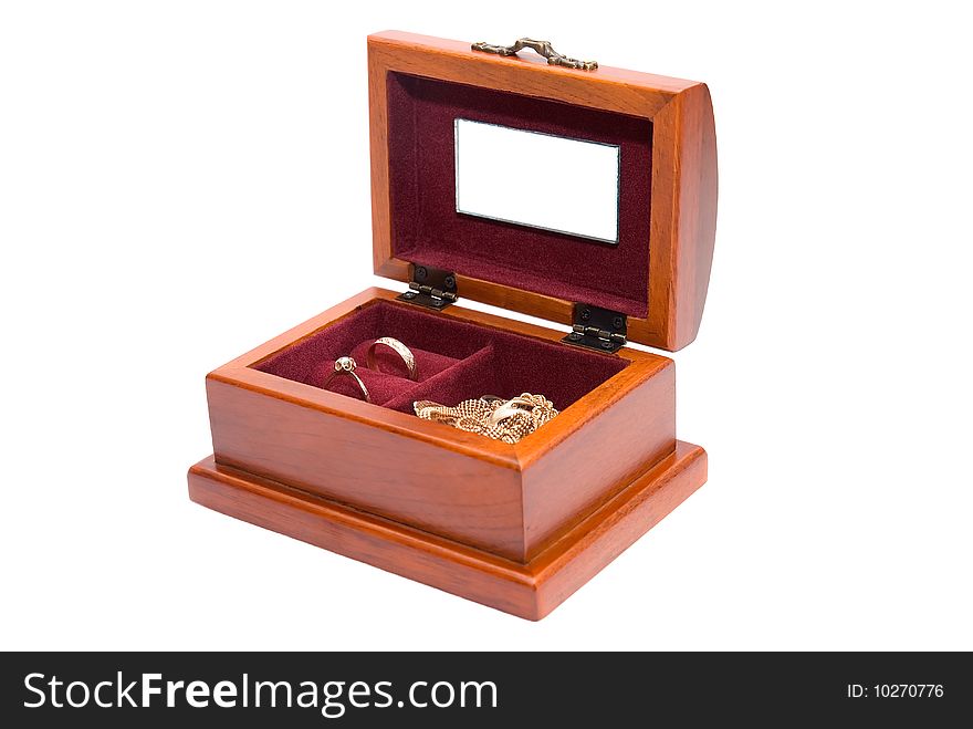 Wooden casket for jewelry is photographed on the white background