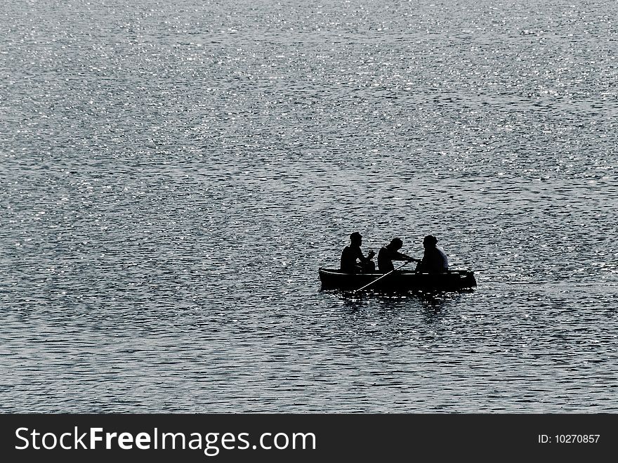 Three persons go boating. Lake. Three persons go boating. Lake