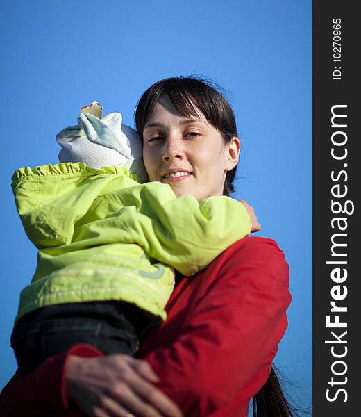 Portrait of a baby with mom outdoors - shallow DOF