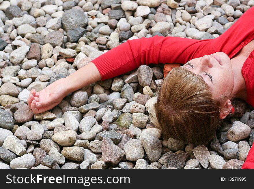Young woman lying on the stones. Young woman lying on the stones