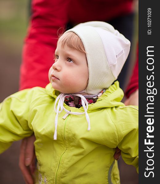 Portrait of an interested baby outdoors - shallow DOF. Portrait of an interested baby outdoors - shallow DOF