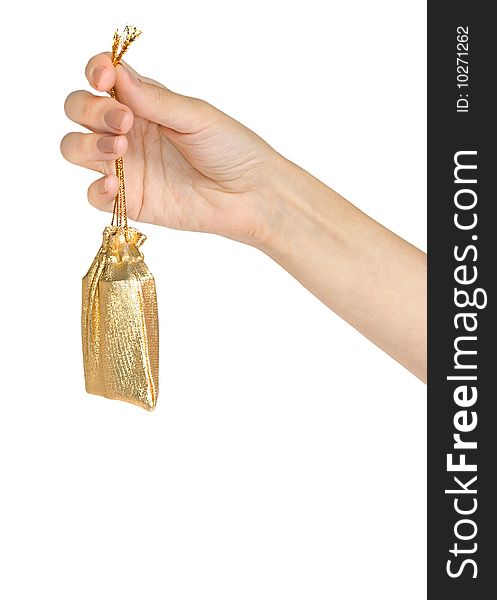 Womanish hand holds a little gold sac isolated on white. Womanish hand holds a little gold sac isolated on white