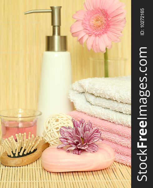 Spa essentials. Towels, soap, candle and  flowers. Spa essentials. Towels, soap, candle and  flowers.