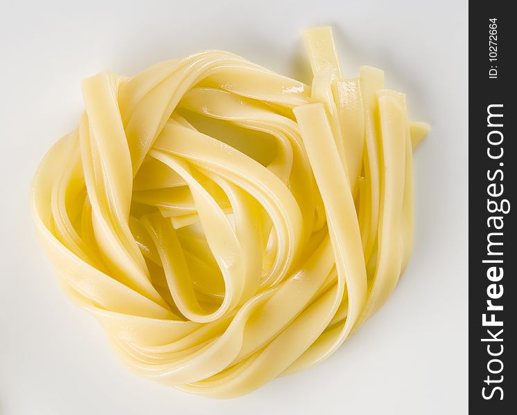 Ribbons of boiled tagliatelle pasta