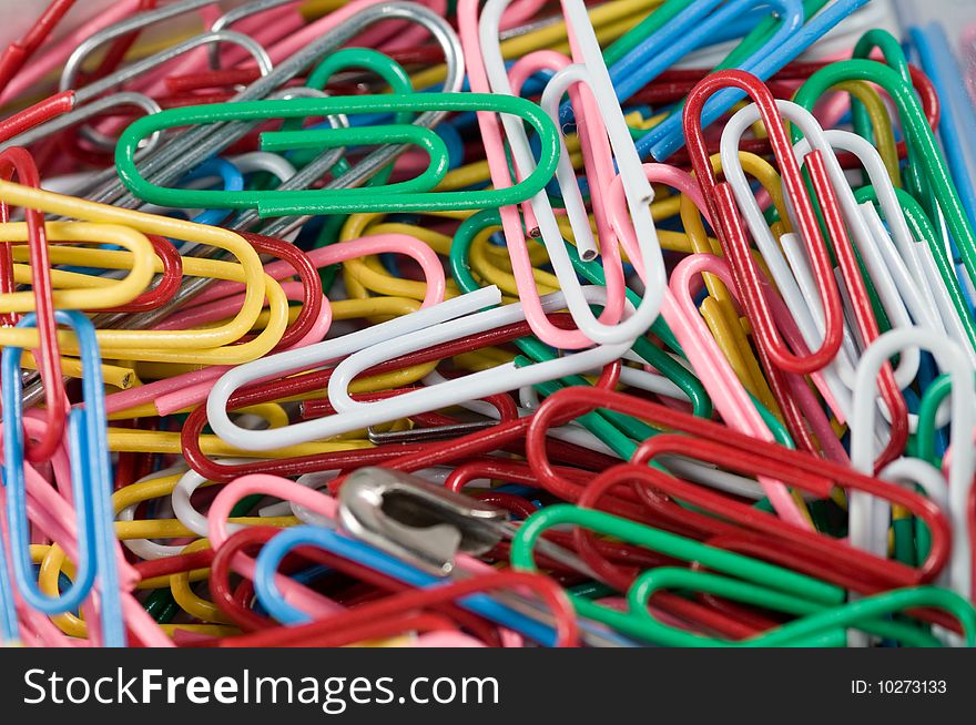 A close up view of a pile of paper clips