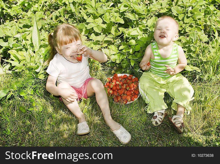 Child Eating Strawberries.