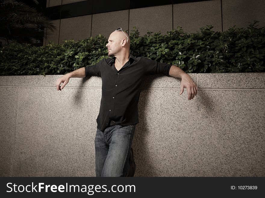 Man Posing By A Wall