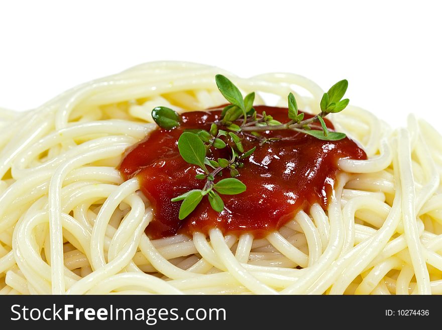 Portion of spaghetti with tomato sauce isolated on a white background