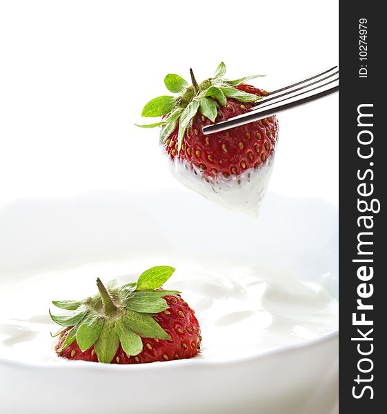 Strawberry with cream on white background