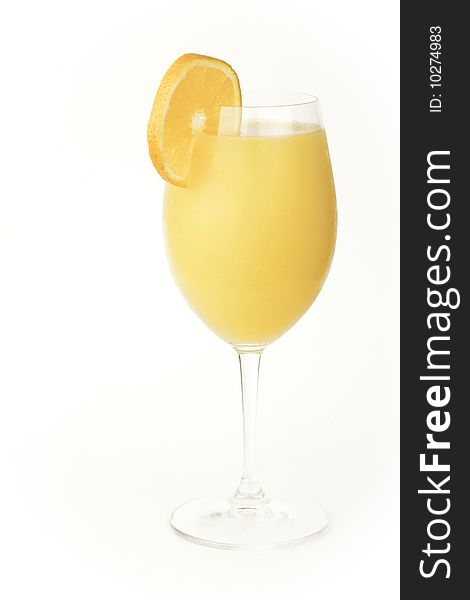 An orange drink isolated against a white background. An orange drink isolated against a white background