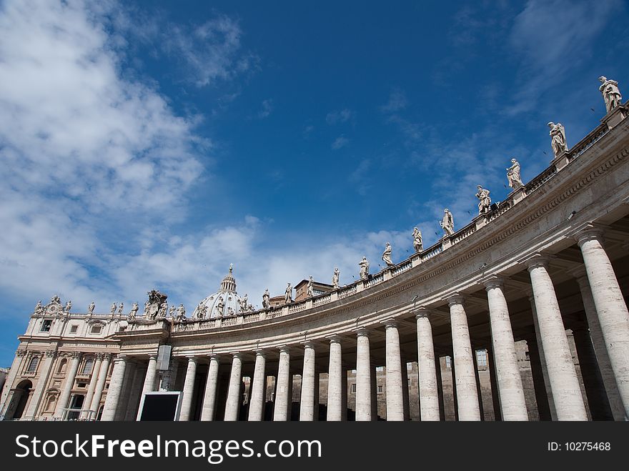 Religious Catholicism sculpture on roof against blue sky. Religious Catholicism sculpture on roof against blue sky