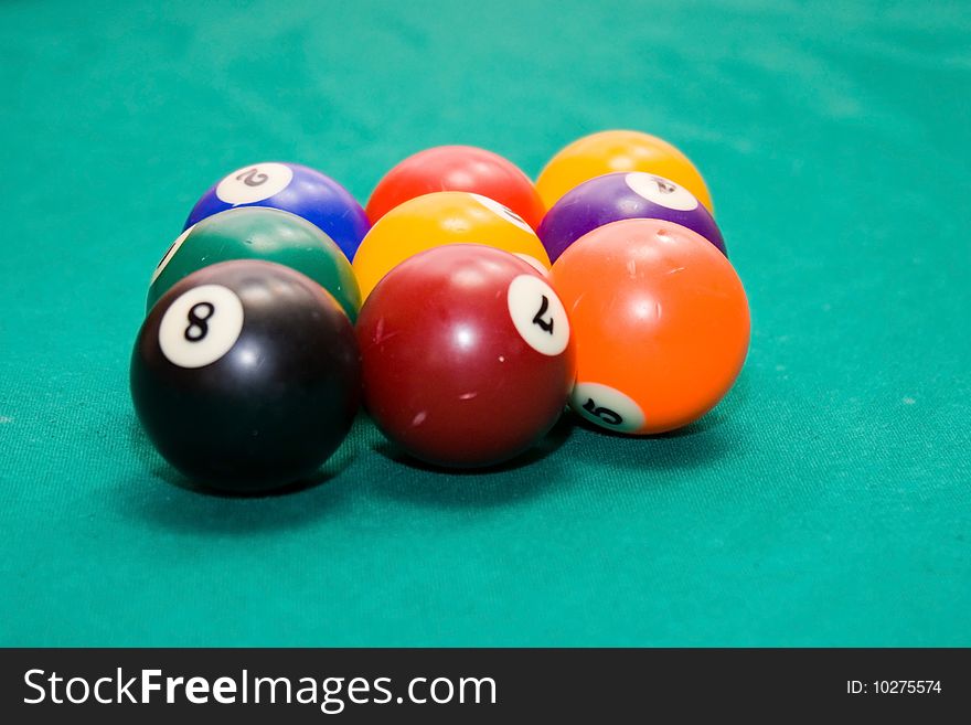 Billiard balls on a green background