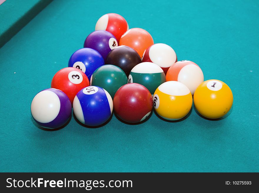 Billiard balls on a green background