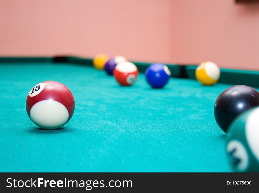 Billiard balls on a green background