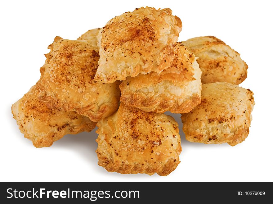 Golden puff pastries with clipping a patch on a white