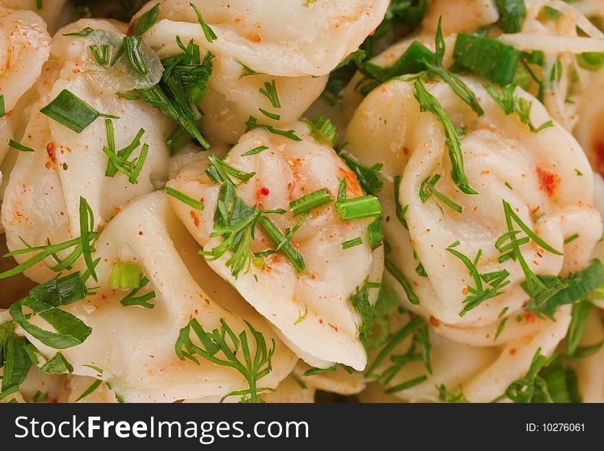 Appetizing ravioli with herbs and spices close up