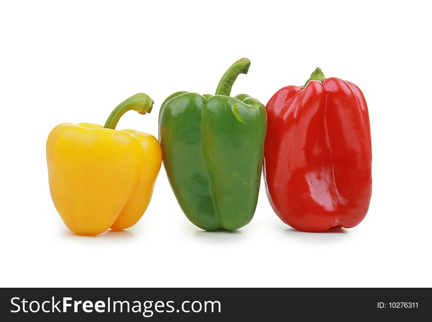Yellow, red and green pepper isolated on white background