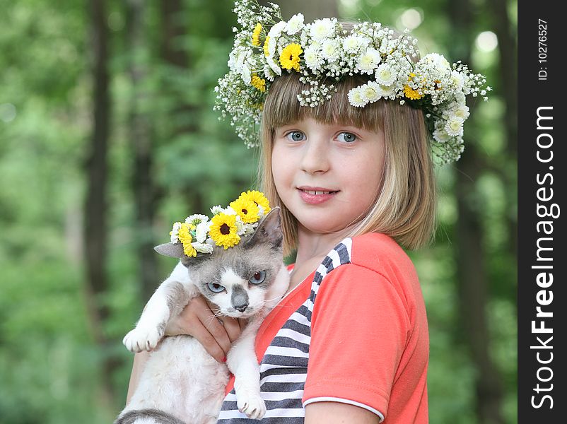 The girl with a kitten in hands. The girl with a kitten in hands.