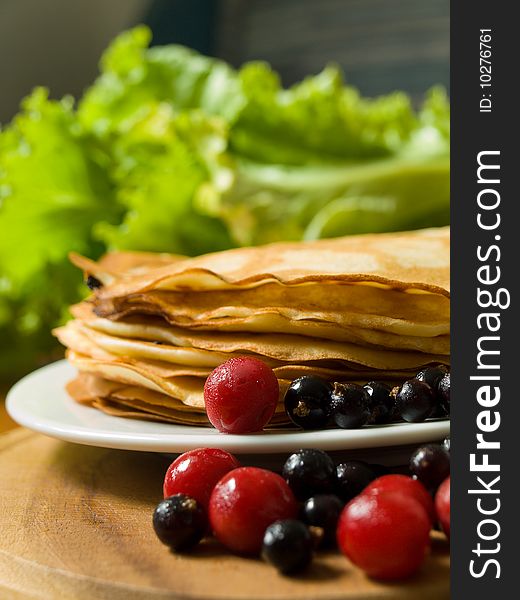 Pancakes with cherries and black currants. Pancakes with cherries and black currants