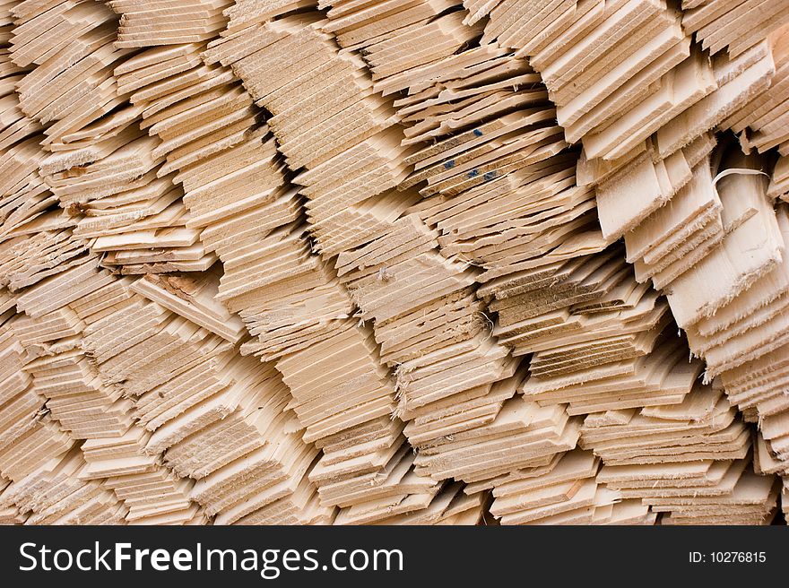 Close up to pile of wooden shingles