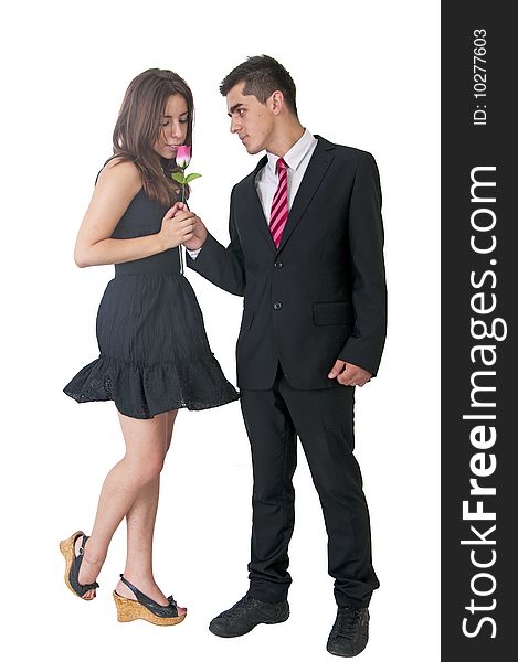 An young man giving flowers to girl. An young man giving flowers to girl