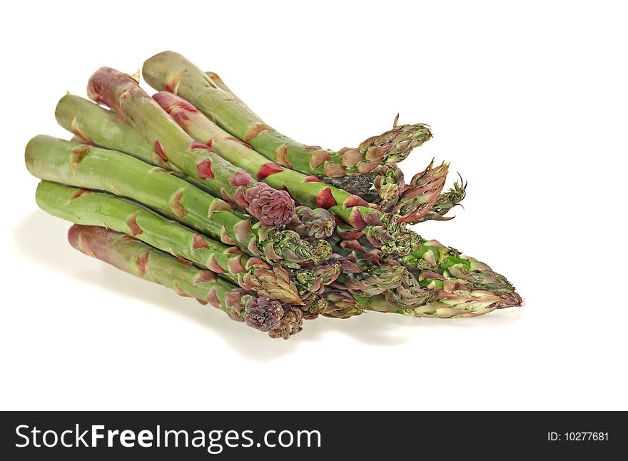 Bunch of asparagus spears on a white background