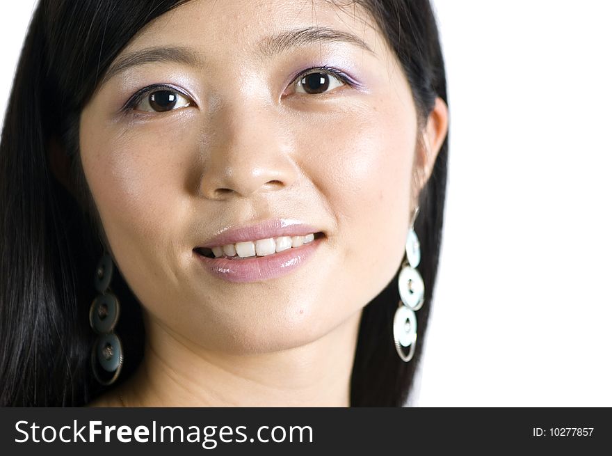 Smiling Chinese girl - portrait. Young, pretty Asian model with kind face expression and charming eyes.