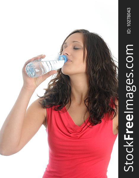 Young woman drinks water from a bottle.