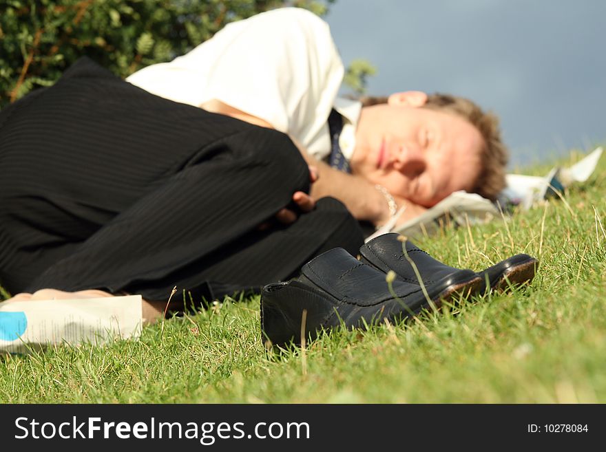 Businessman Sleeping In Park