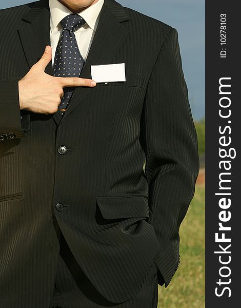 Businessman pointing at empty card with his finger