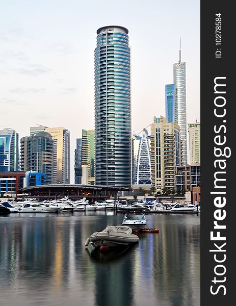 Luxury Yachts in Dubai Marina with waterfront Apartments in the background. Luxury Yachts in Dubai Marina with waterfront Apartments in the background