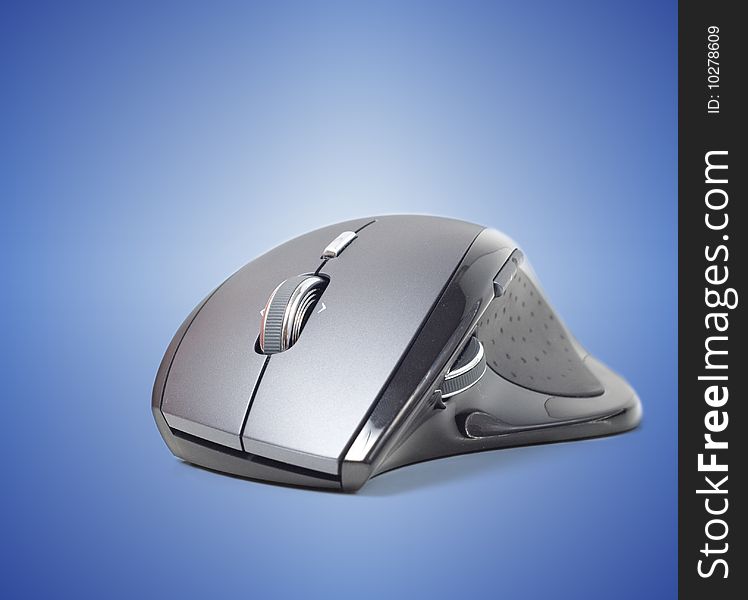 Computer mouse against a blue background.