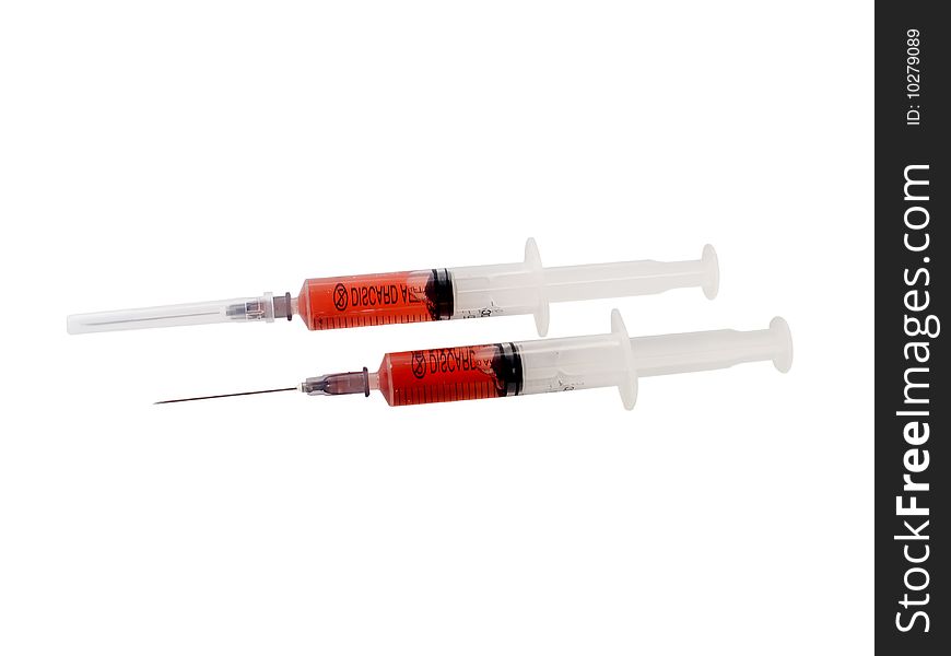 Two filled syringe isolated on white background. Two filled syringe isolated on white background.