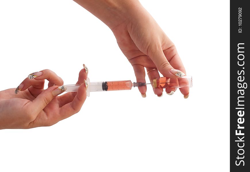 Filled Syringe In A Woman Hands.