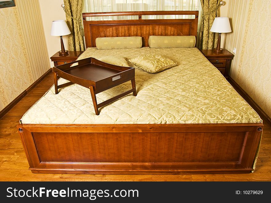 Cosy bedroom with large bed - front view