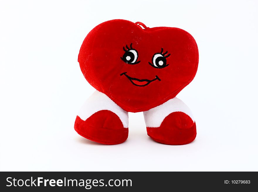 Red heart of plush, with legs and eyes, isolated
