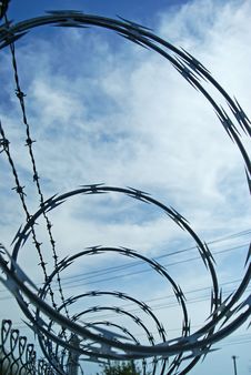 Razor Wire And Barbed Wire Fencing Stock Photo