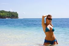 Blonde Girl Relaxing In Water On The Beach Stock Photography