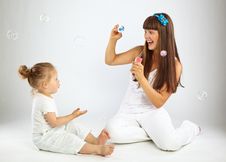 Little Girl And Her Mother Blowing Bubbles Royalty Free Stock Photo Little Girl And Her Mother Blowing Bubbles Royalty Free Stock Photo