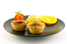 Jam Tarts On A Black Plate Stock Photography Jam Tarts On A Black Plate Stock Photography