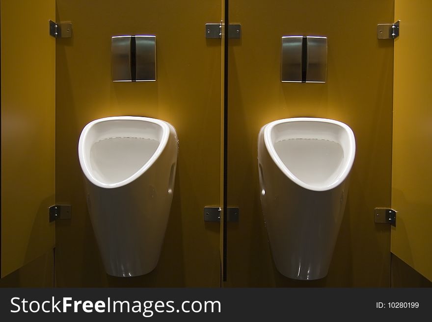 Two urinals in a public restroom