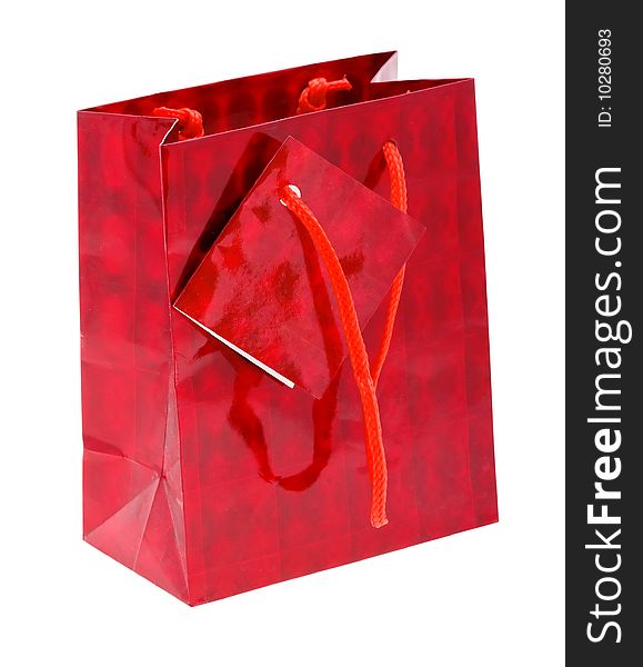 Red paper shopping bag isolated on white