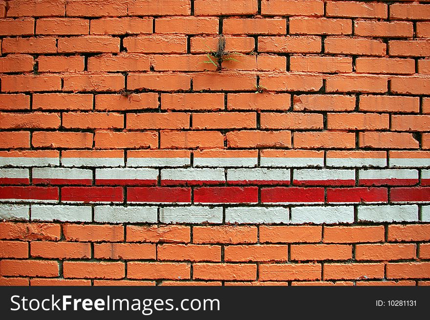 Orange brick wall and red white line