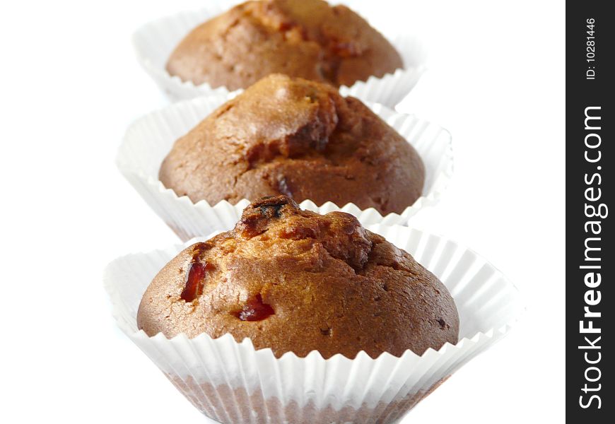 Fruit cupcakes isolated over white background. Shallow dof.