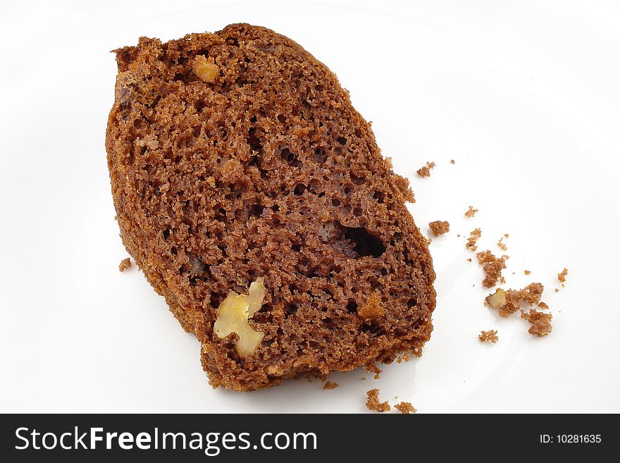 Chocolate cake piece with nuts on white background. Chocolate cake piece with nuts on white background