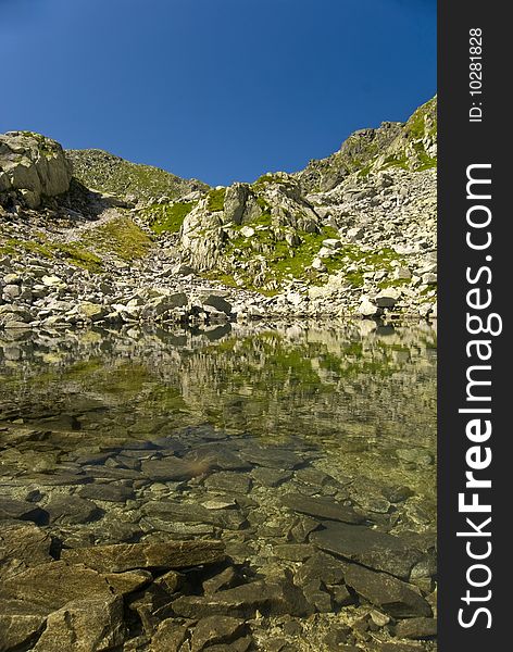 Romanian Carpathians Retezat Mountain part of Panpark on summer. Glacial lake;