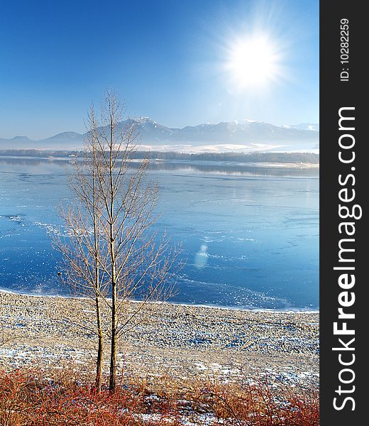 A view of the frozen lake and the sun.