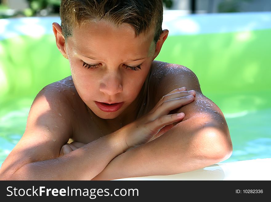 Young boy in the swimming pool