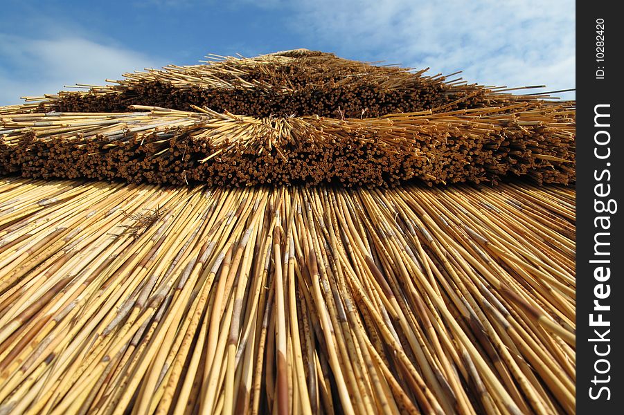 A thatched roof of a summer house in Gloucestershire, UK. A thatched roof of a summer house in Gloucestershire, UK