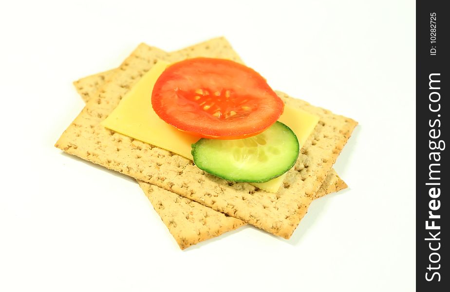 Tomatoes ogrurets and cheese on a white background